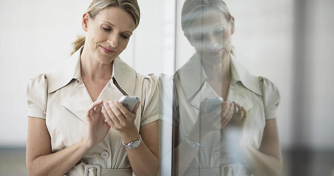 Women on smartphone Accessing HR portal information