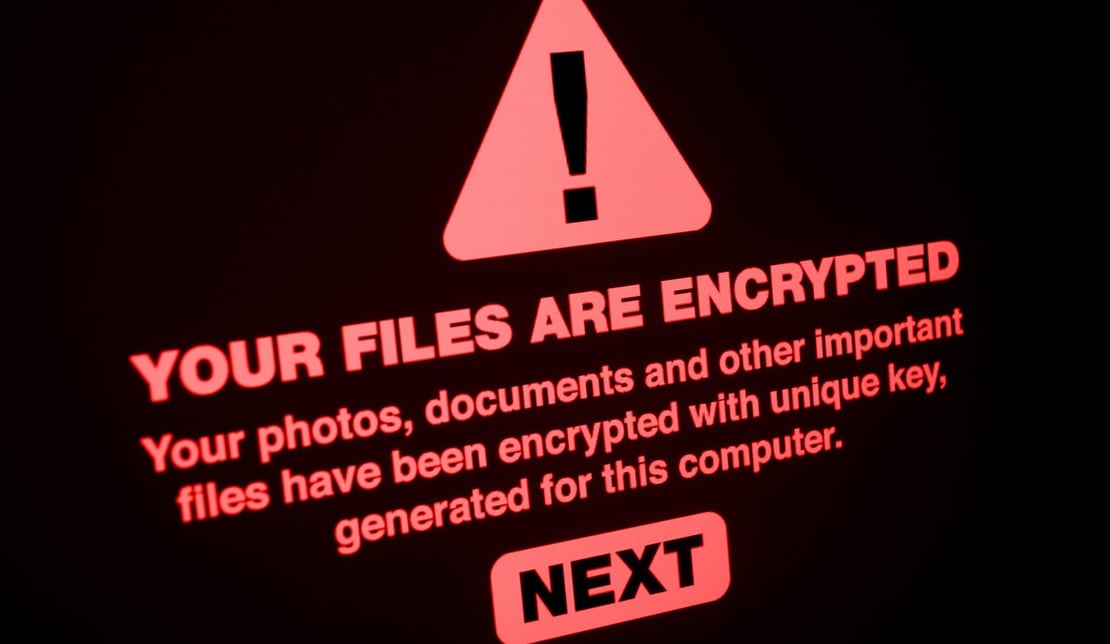 Encrypted computer screen threats cybersecurity ransomware SIZED