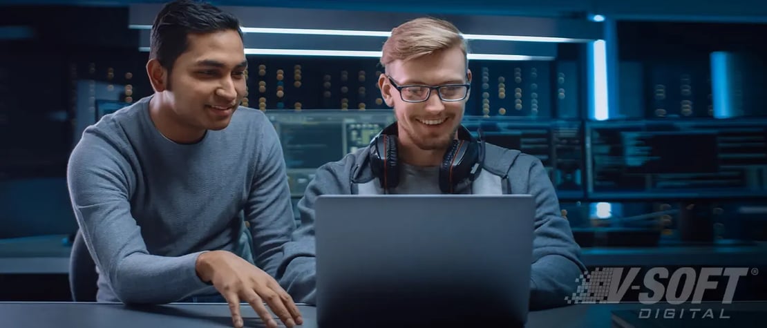 Two API engineers working in the office in 2023