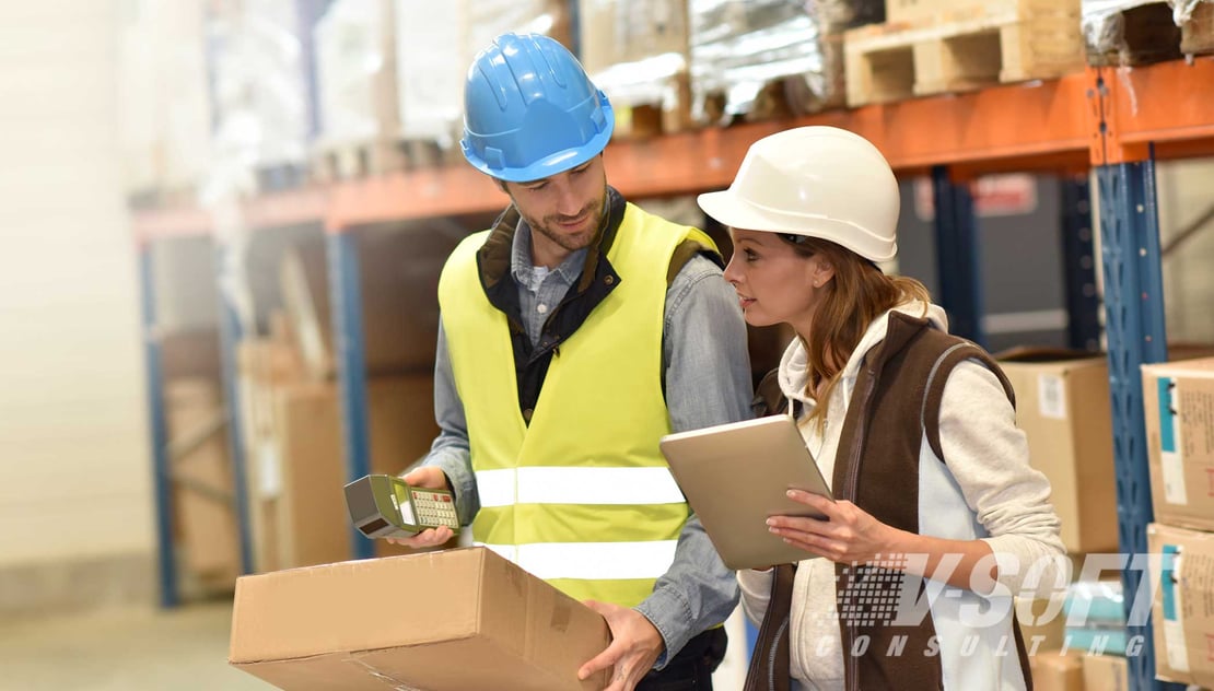 Warehouse workers using mobile app for logistics
